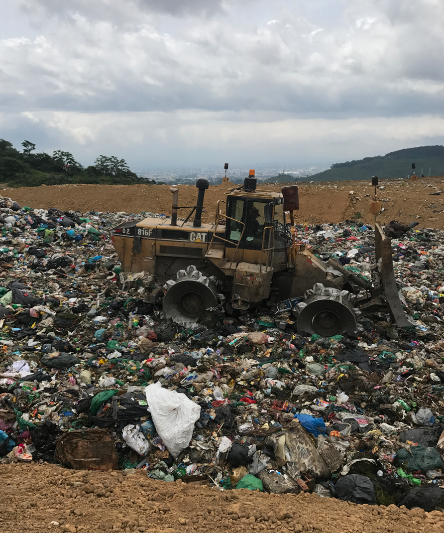 The waste is driven over by heavy machines.