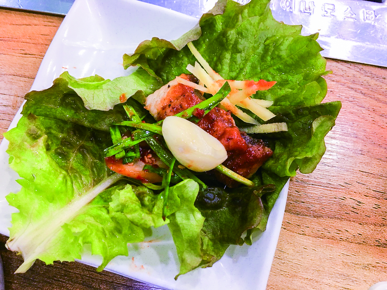 How to eat eel in Korea; eel with Korean lettuce and special sauce in Korean style.
